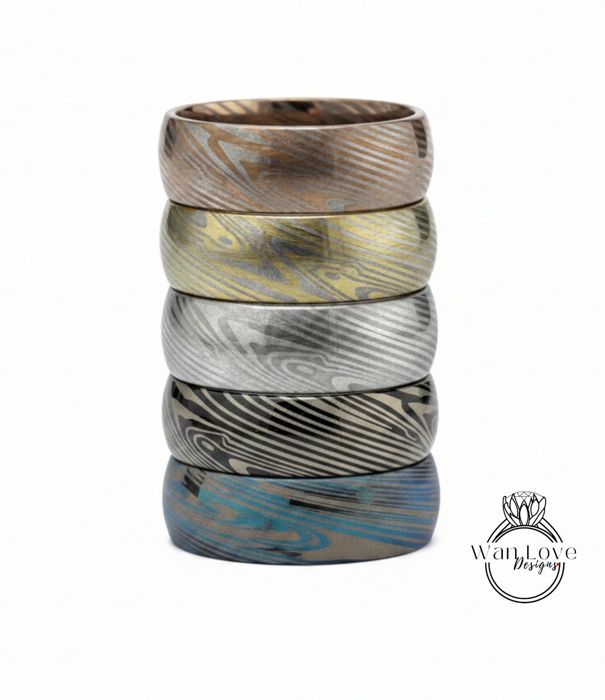 A stack of five rings with unique, colorful designs.