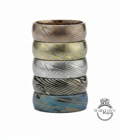 A stack of five rings with unique, colorful designs.