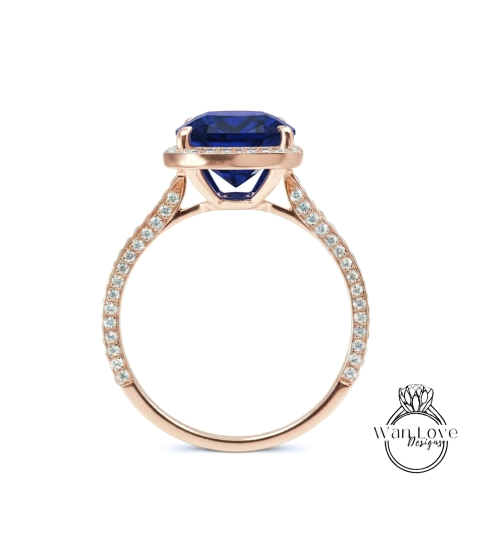 A gold ring with a large blue gemstone set in the center, surrounded by smaller diamonds.