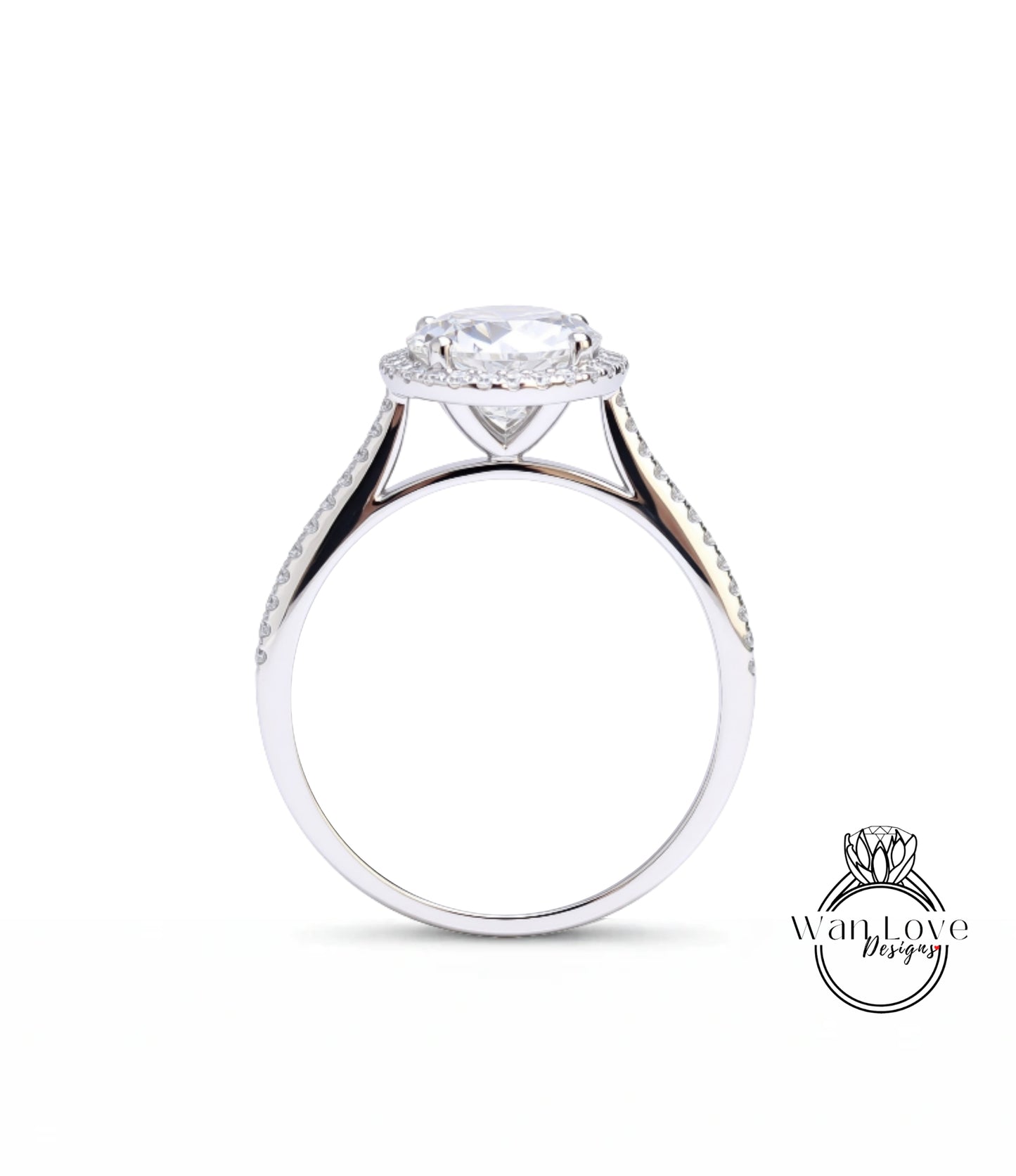 A silver engagement ring with a large central diamond surrounded by smaller diamonds on the band.