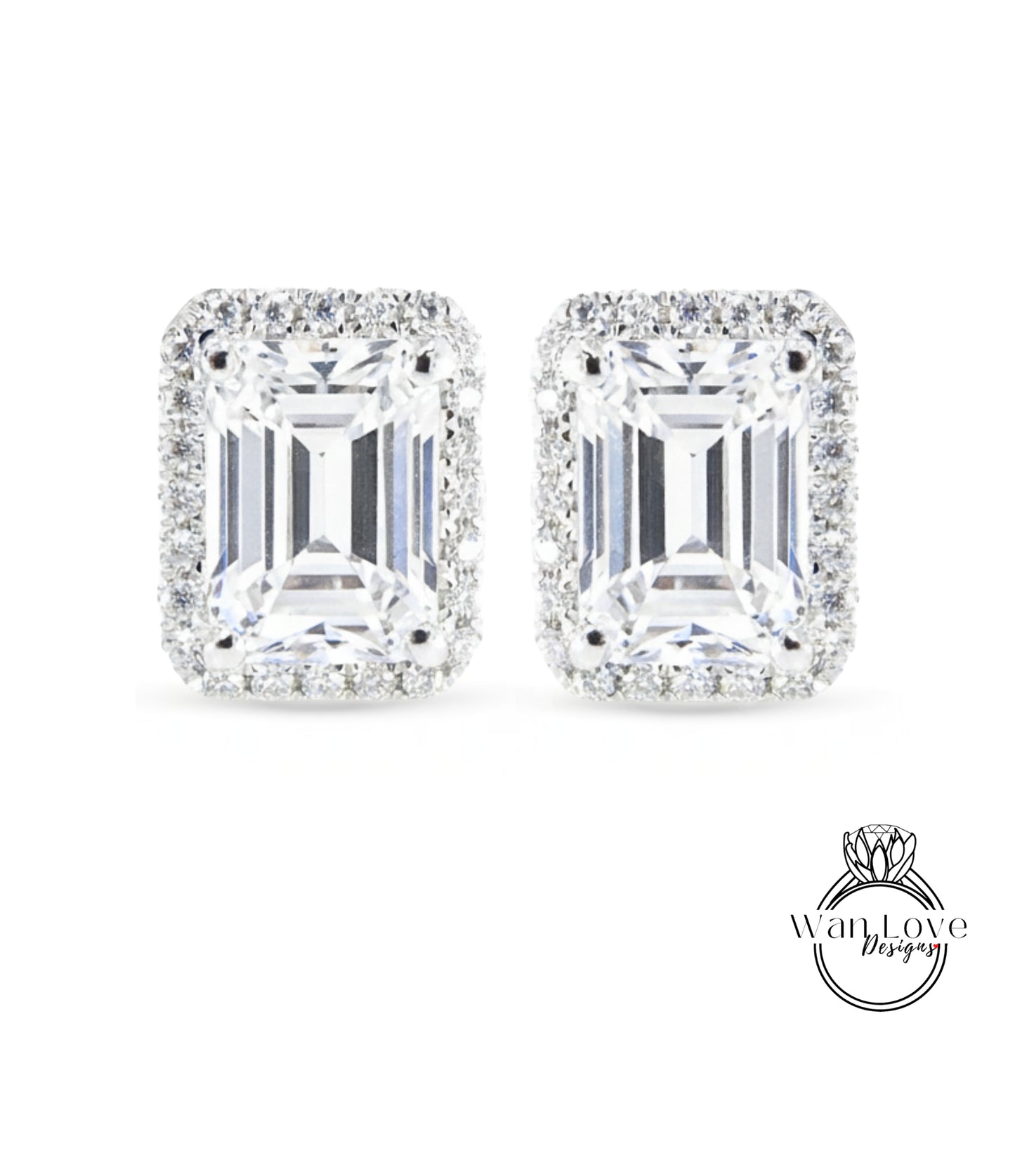 A pair of elegant earrings with large, clear gemstones set in a halo of smaller diamonds.