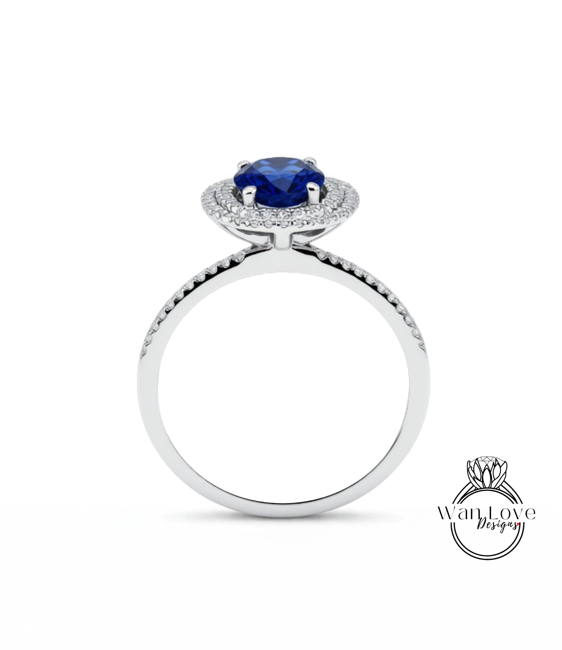 A silver ring with a large blue gemstone at the center, surrounded by smaller diamonds.