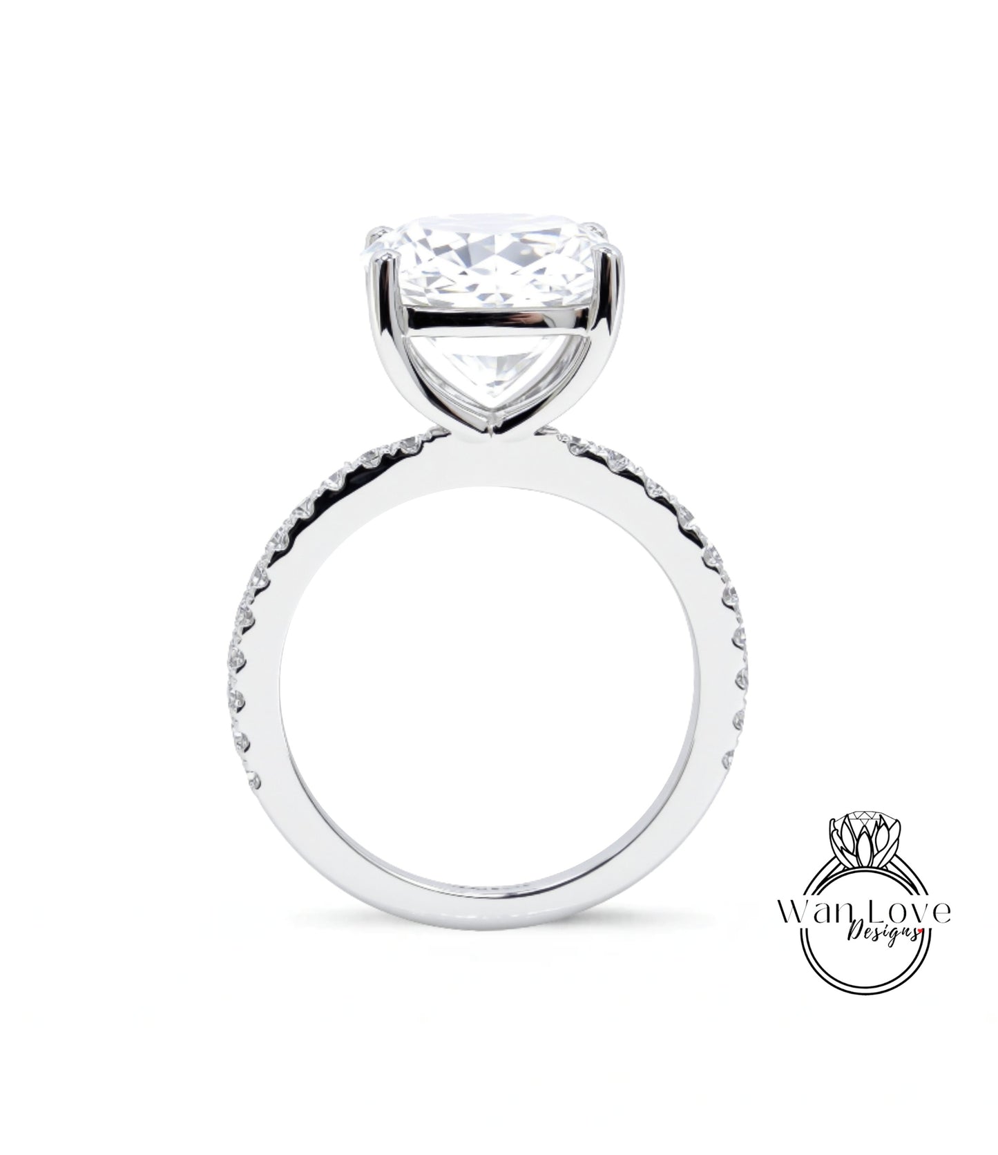 A large, clear diamond engagement ring with a large central diamond and a smaller diamond band around the base.