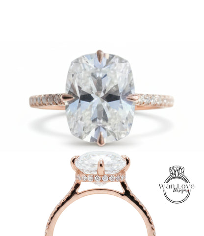 a large, clear diamond engagement ring with a rose gold band and a central pavé gemstone.