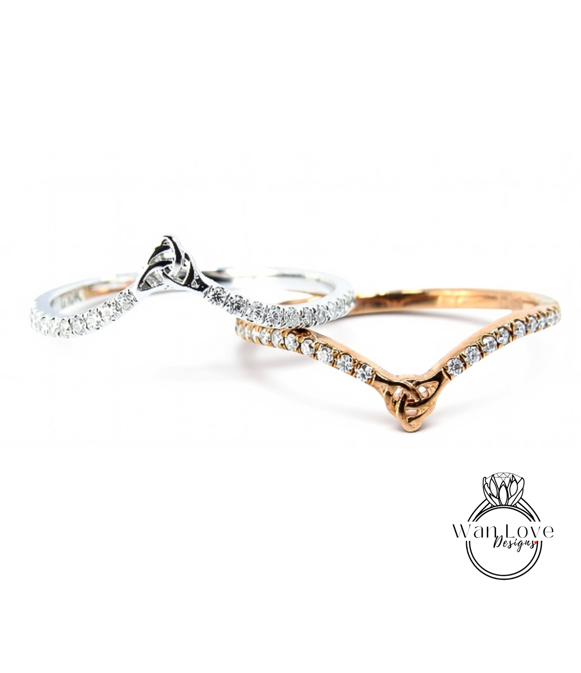 three rings with diamonds set in them, arranged in a row.