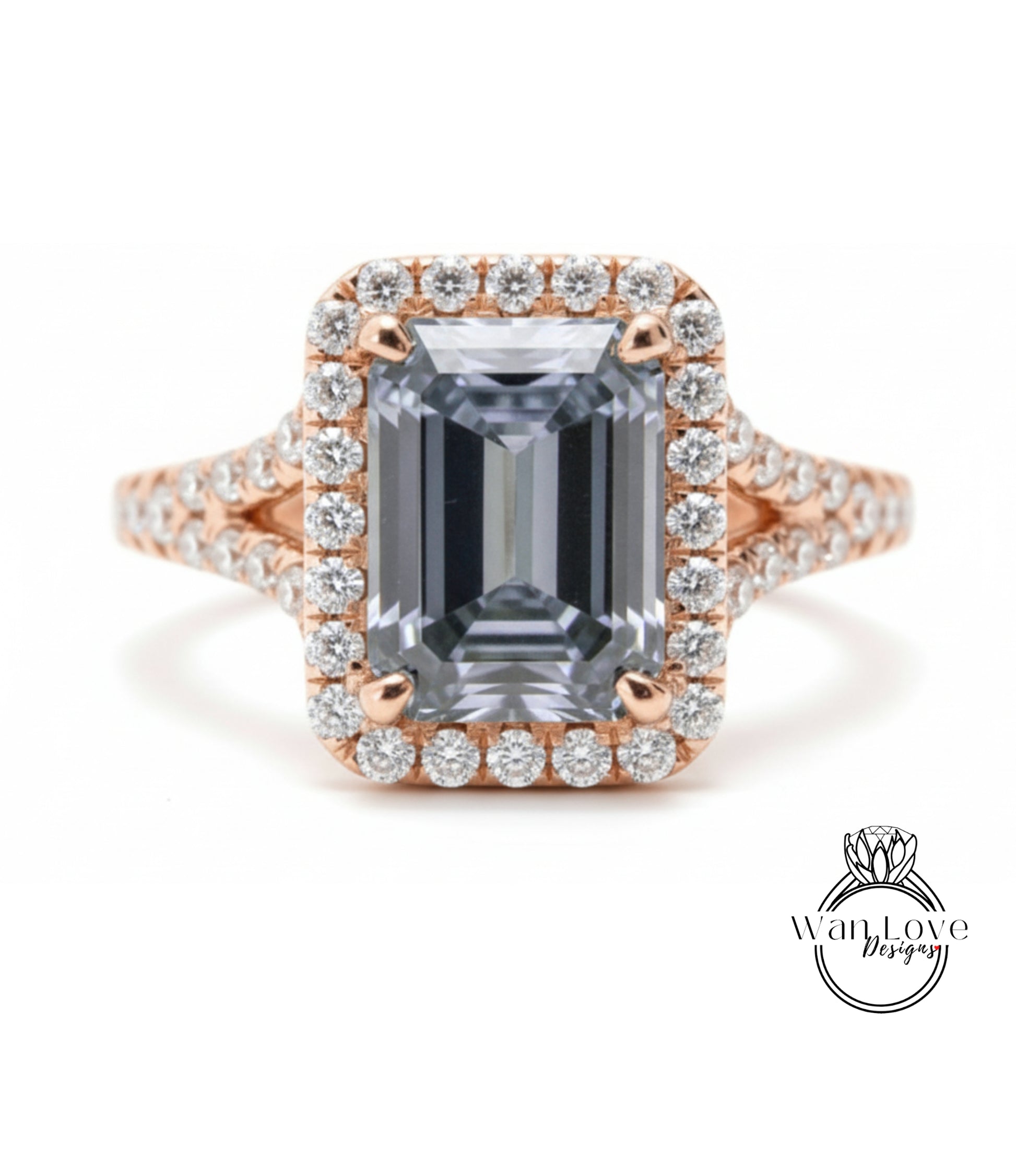 A large, rectangular diamond ring with a halo of smaller diamonds around the center stone.