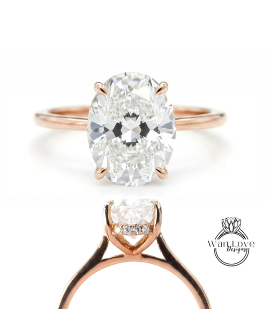 a beautiful diamond engagement ring with a large oval-shaped diamond set in a rose gold band.
