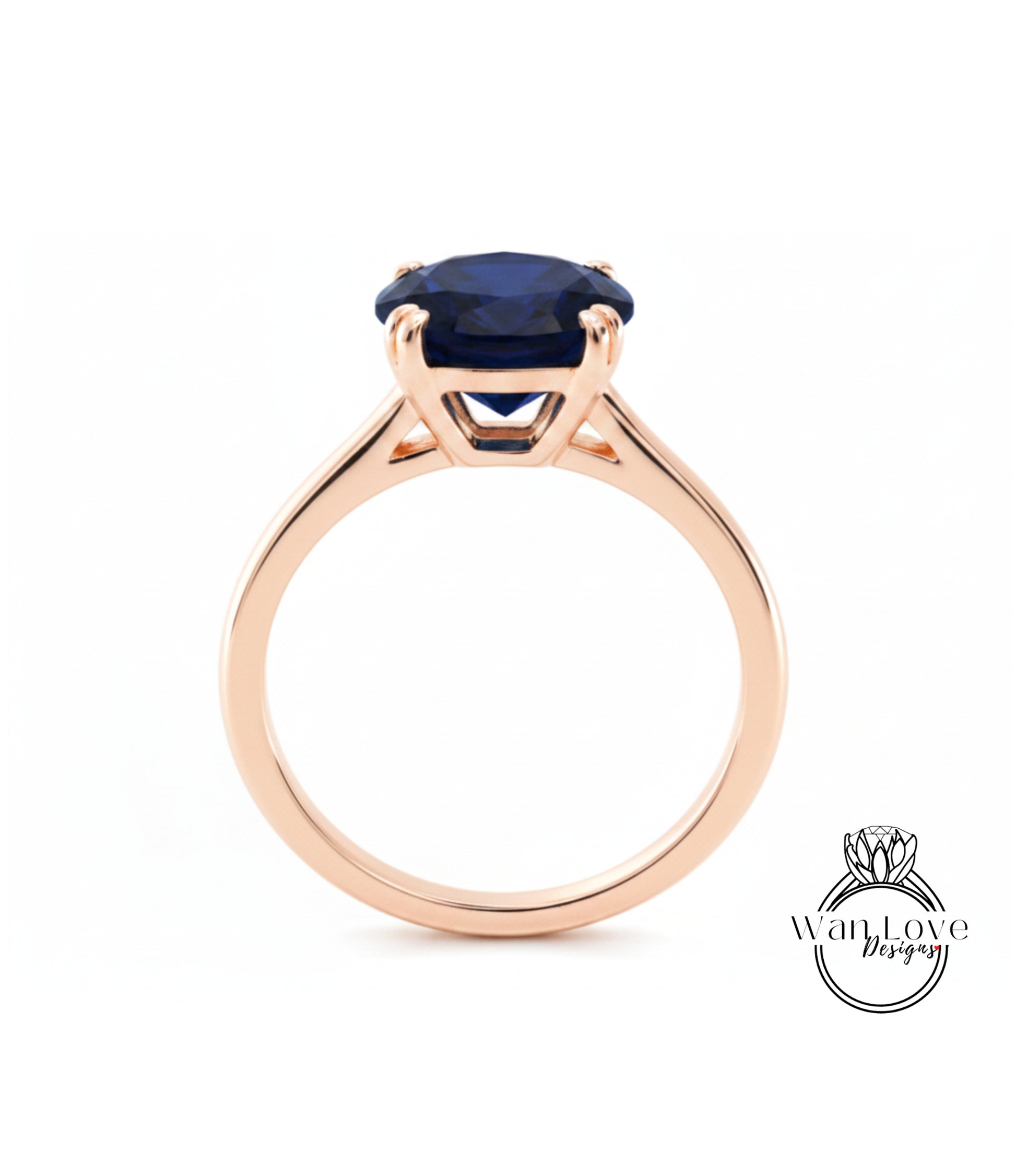 A gold ring with a large blue gemstone set in the center.