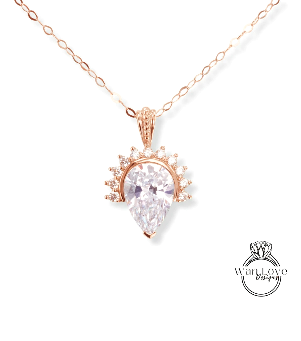 A necklace with a large, clear gemstone pendant, possibly a diamond, surrounded by smaller diamonds.