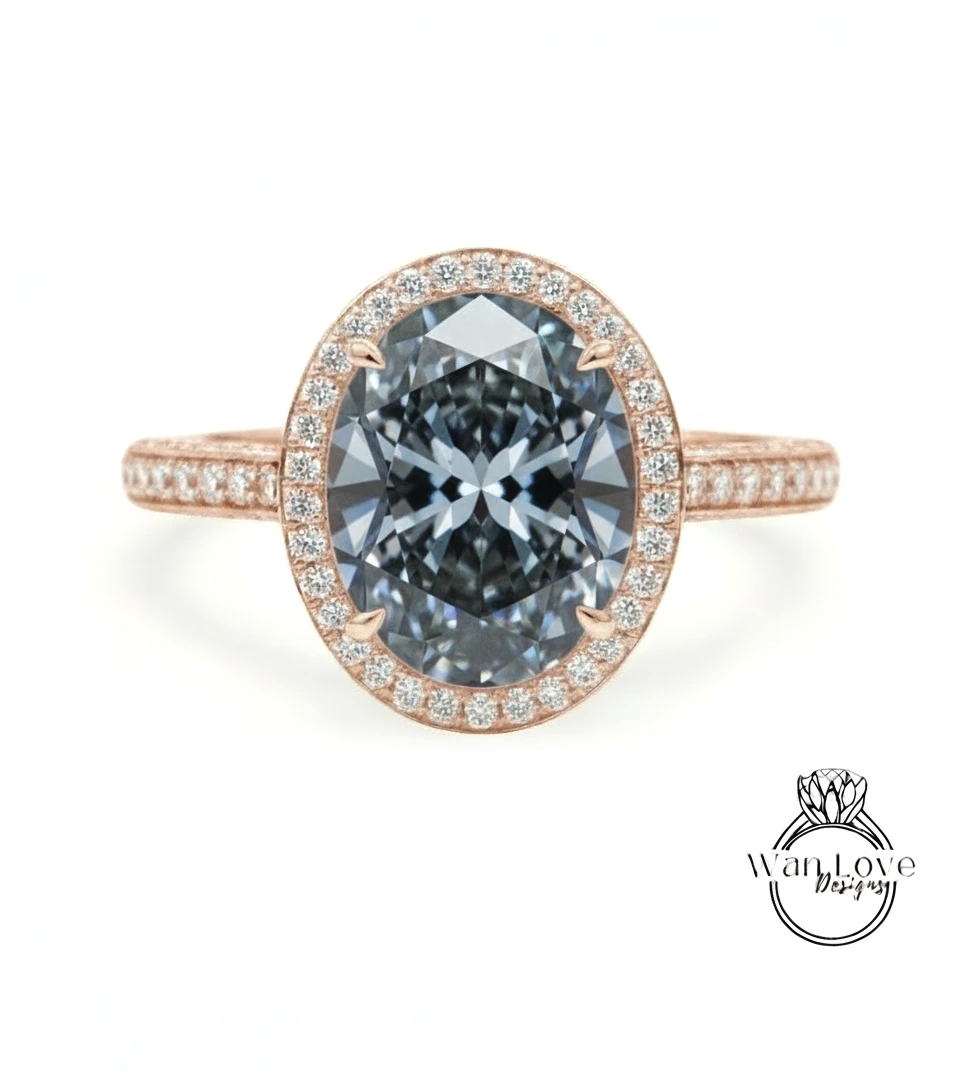 A rose gold ring with a large oval-shaped diamond set in the center, surrounded by smaller diamonds.
