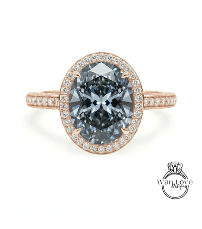 A rose gold ring with a large oval-shaped diamond set in the center, surrounded by smaller diamonds.