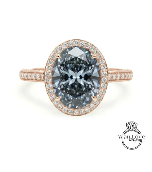 A rose gold ring with a large oval-shaped diamond set in the center, surrounded by smaller diamonds.