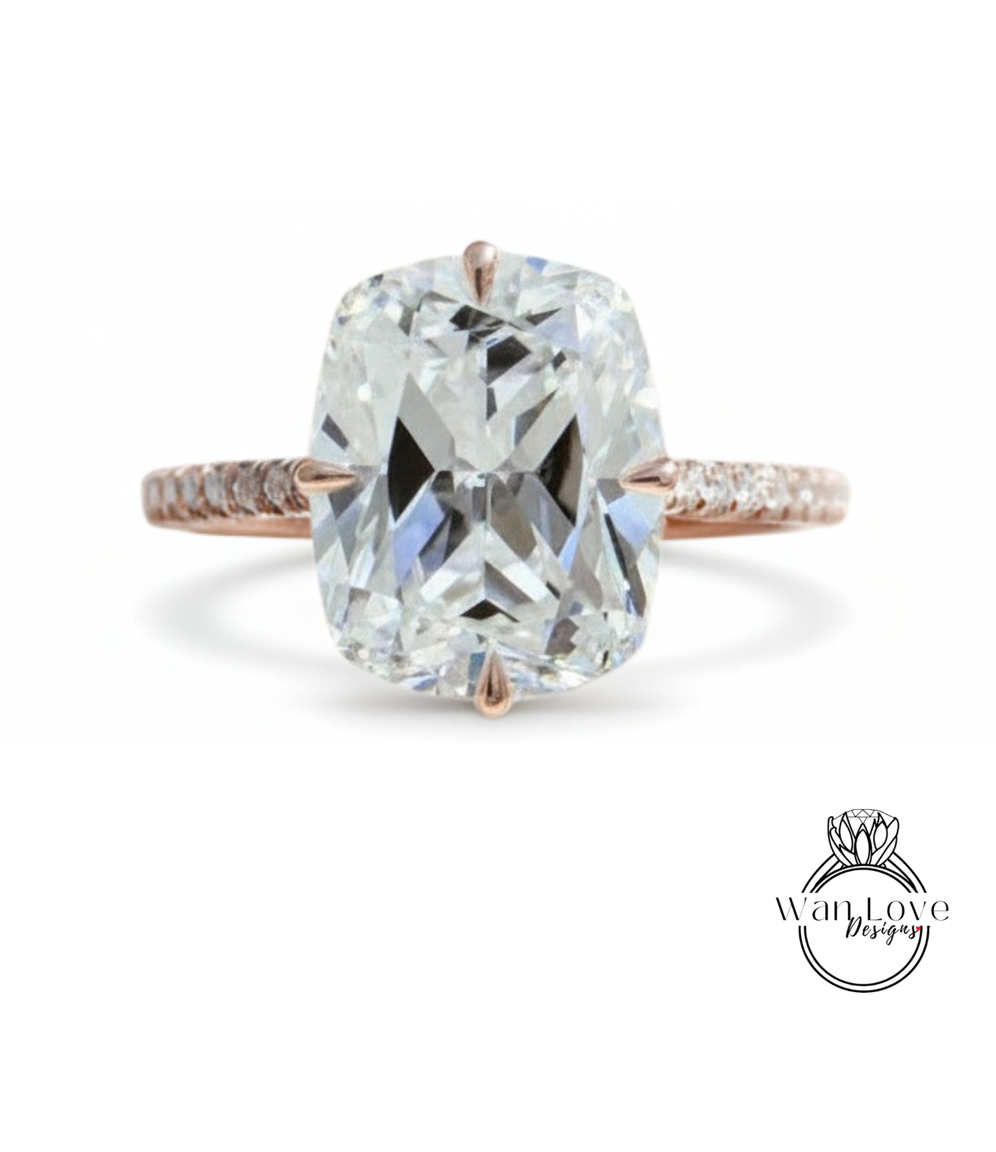 A large, clear diamond engagement ring with a rose gold band and a large central diamond.