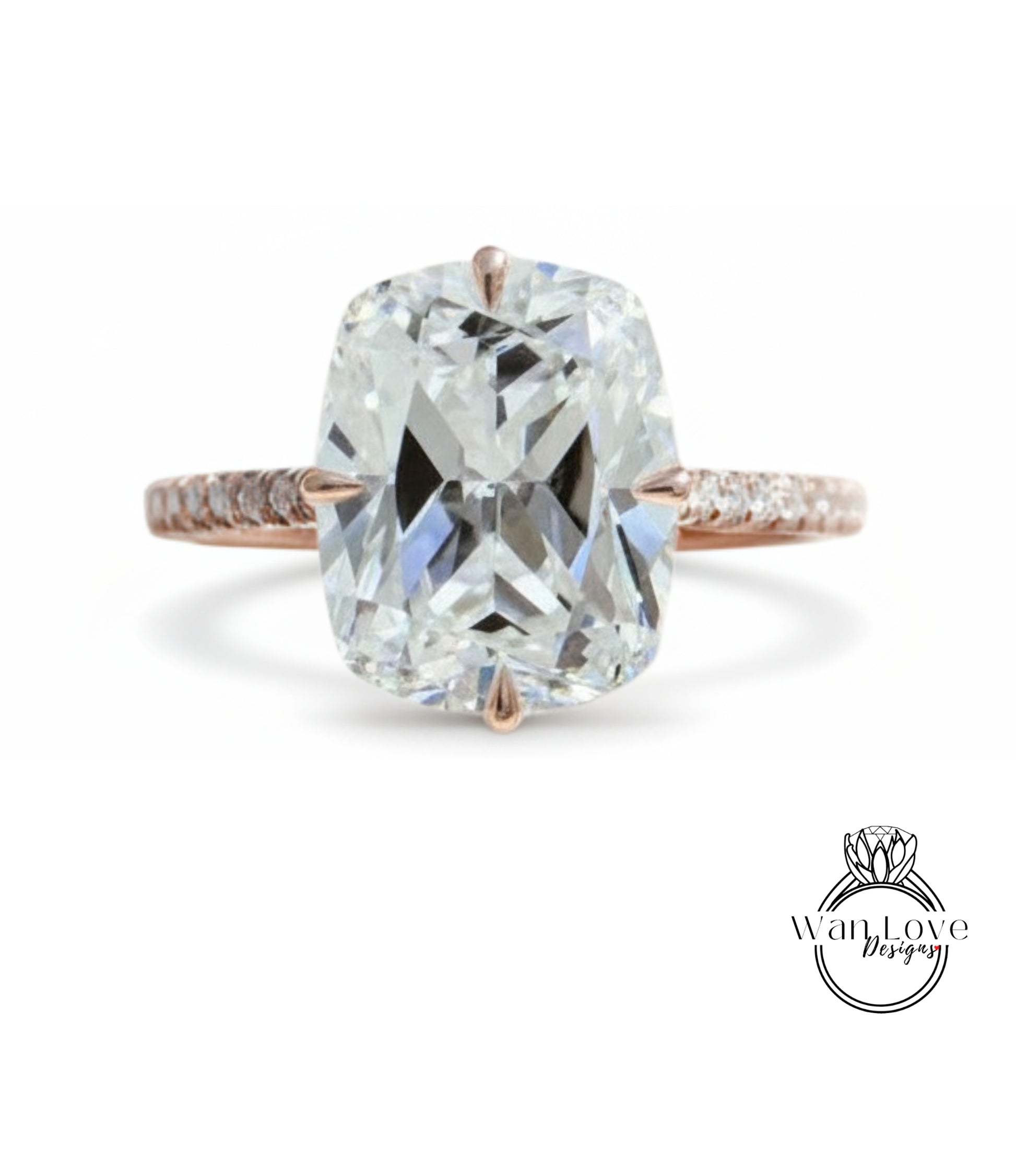 A large, clear diamond engagement ring with a rose gold band and a large central diamond.