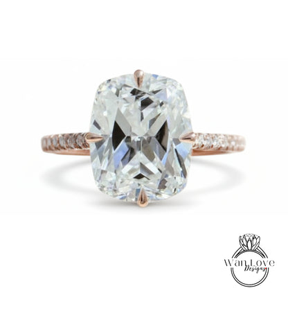 A large, clear diamond engagement ring with a rose gold band and a large central diamond.
