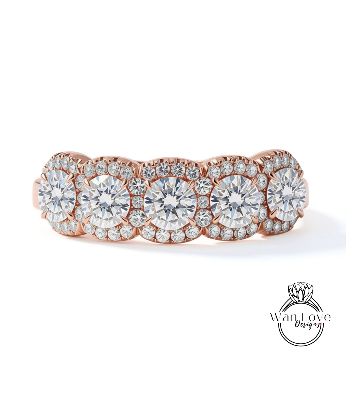 A beautiful rose gold ring with a row of large, sparkling diamonds set in the center.