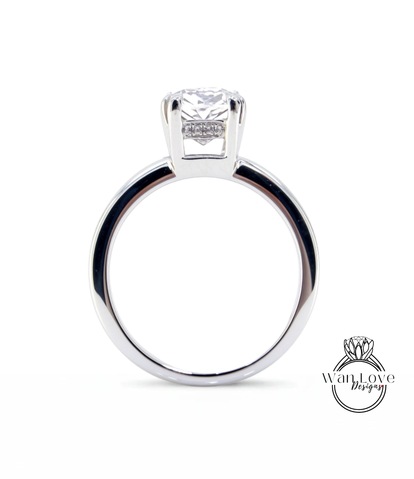 A silver engagement ring with a large diamond set in the center.
