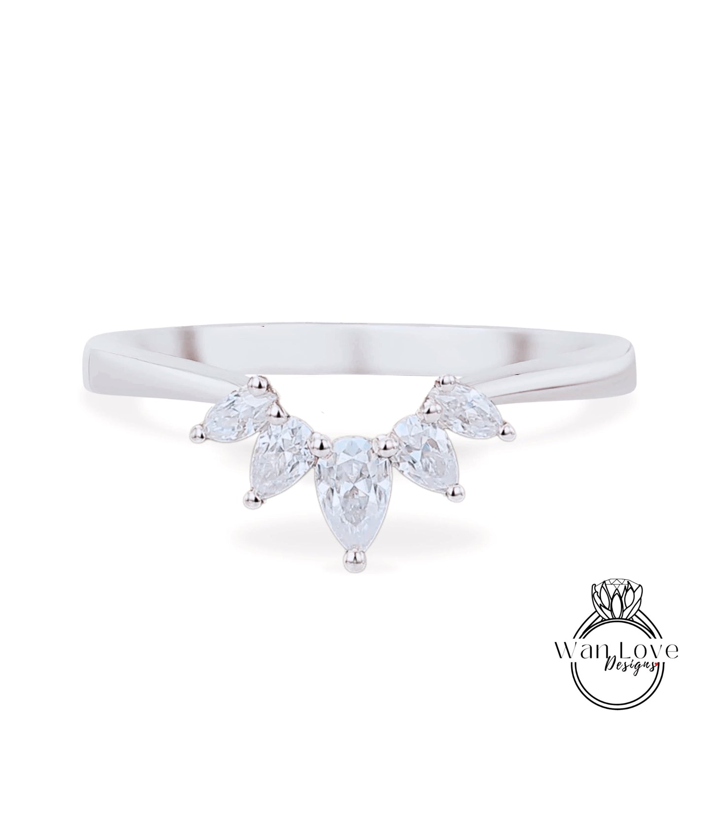 A silver ring with a large, clear gemstone set in the center, surrounded by smaller, clear gemstones.