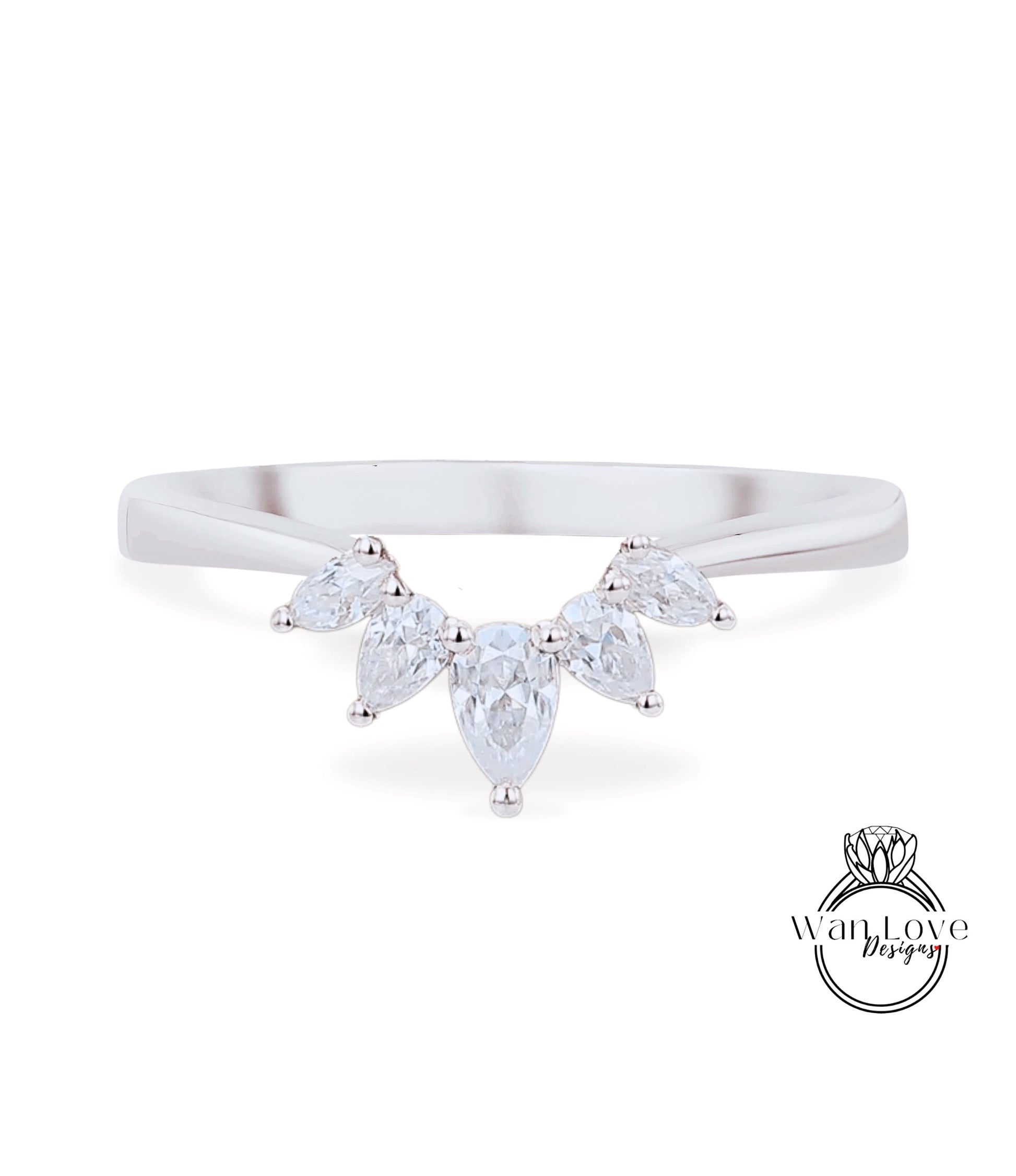 A silver ring with a large, clear gemstone set in the center, surrounded by smaller, clear gemstones.