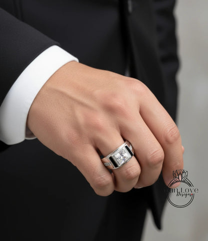 A close-up of a person's hand wearing a large, ornate ring on the ring finger.