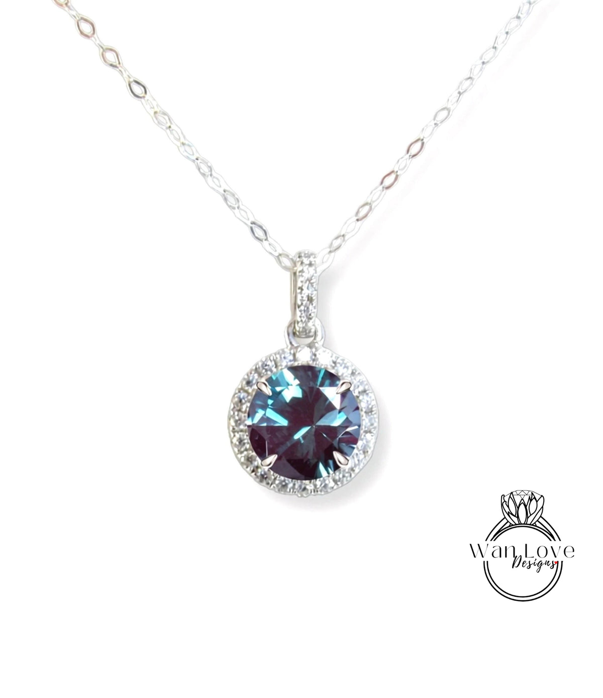 A necklace with a large blue gemstone pendant, which appears to be a sapphire or amethyst.