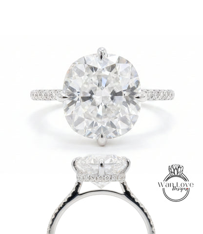 A stunning diamond engagement ring with a large round brilliant cut diamond set in a halo of smaller diamonds, surrounded by a halo of smaller diamonds on the band.