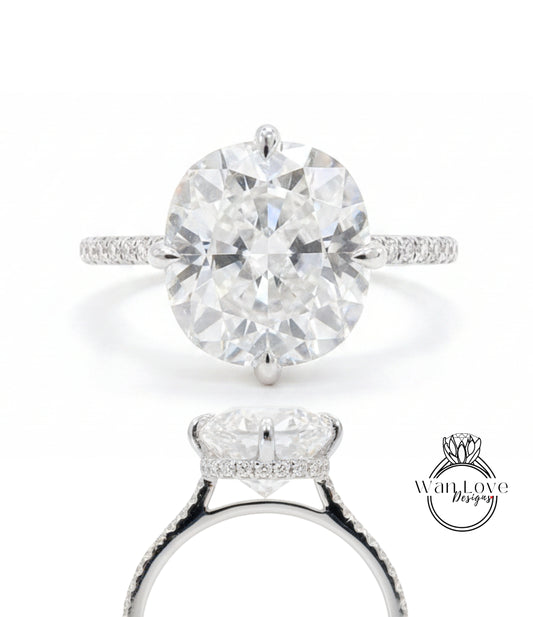 A stunning diamond engagement ring with a large round brilliant cut diamond set in a halo of smaller diamonds, surrounded by a halo of smaller diamonds on the band.