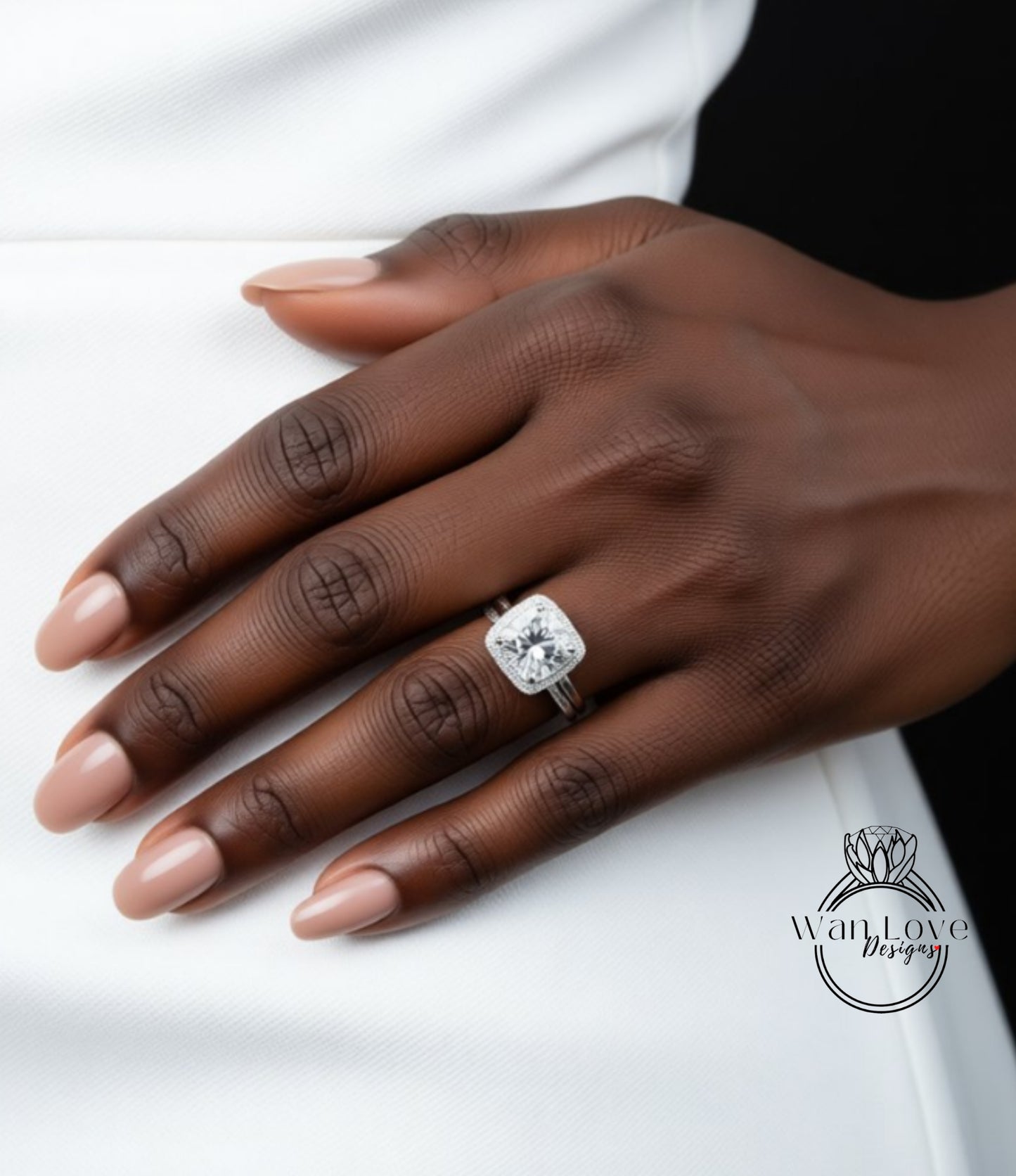 A close-up of a person's hand wearing a large diamond engagement ring.