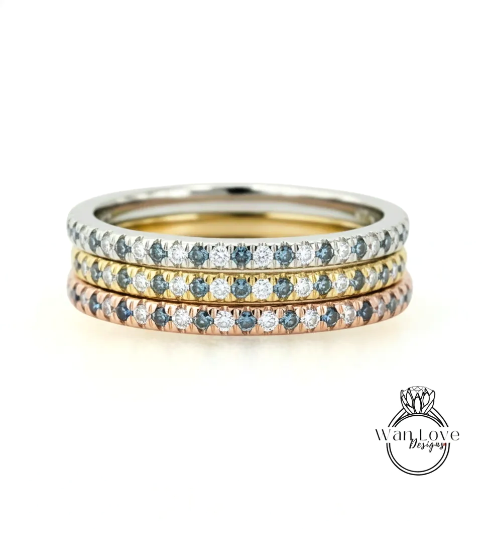 A stack of three rings with blue sapphires and diamonds set in a silver band.