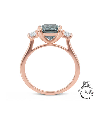 A rose gold engagement ring with a large blue gemstone set in the center, surrounded by smaller diamonds.