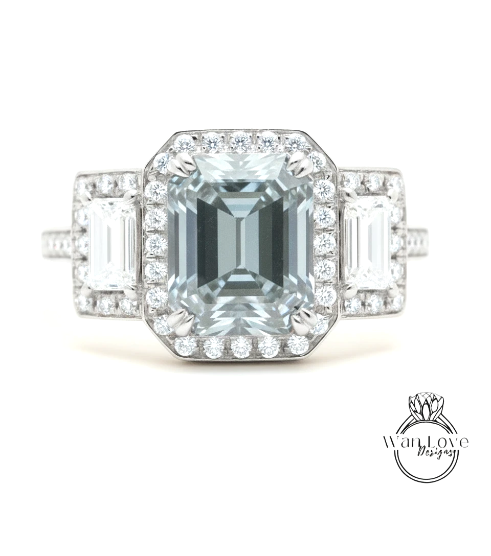 A stunning engagement ring with a large, clear gemstone surrounded by smaller diamonds, set in a halo of smaller diamonds.