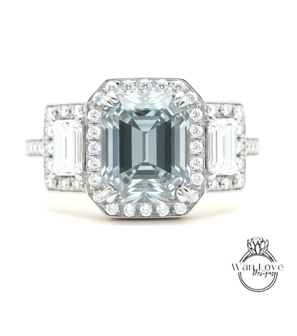 A stunning engagement ring with a large, clear gemstone surrounded by smaller diamonds, set in a halo of smaller diamonds.