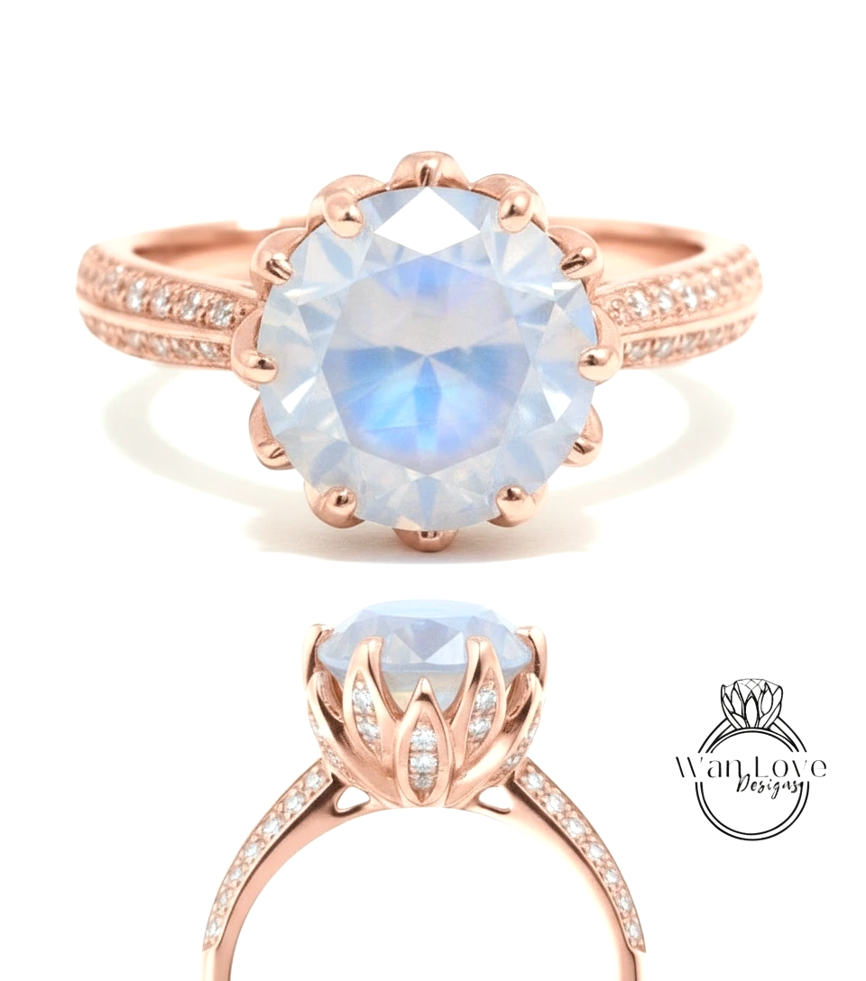 a beautiful rose gold ring with a large blue gemstone, likely a moonstone, set in a delicate flower-like design.