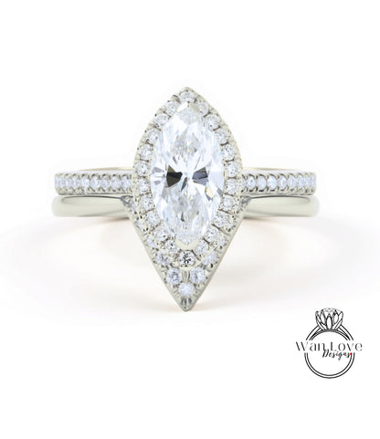 A close-up view of a diamond engagement ring with a large central diamond surrounded by smaller diamonds on the band.