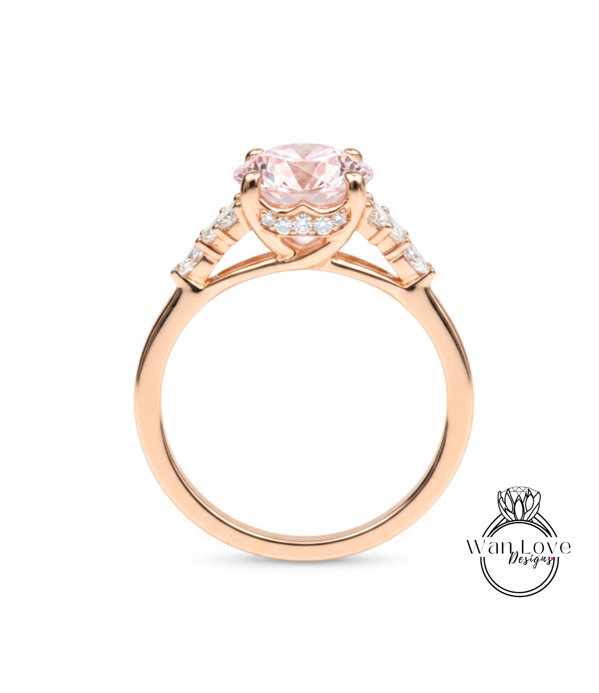 A gold ring with a large pink gemstone, possibly a diamond, set in the center.