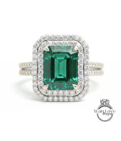 A large, green gemstone set in a diamond-encrusted ring.