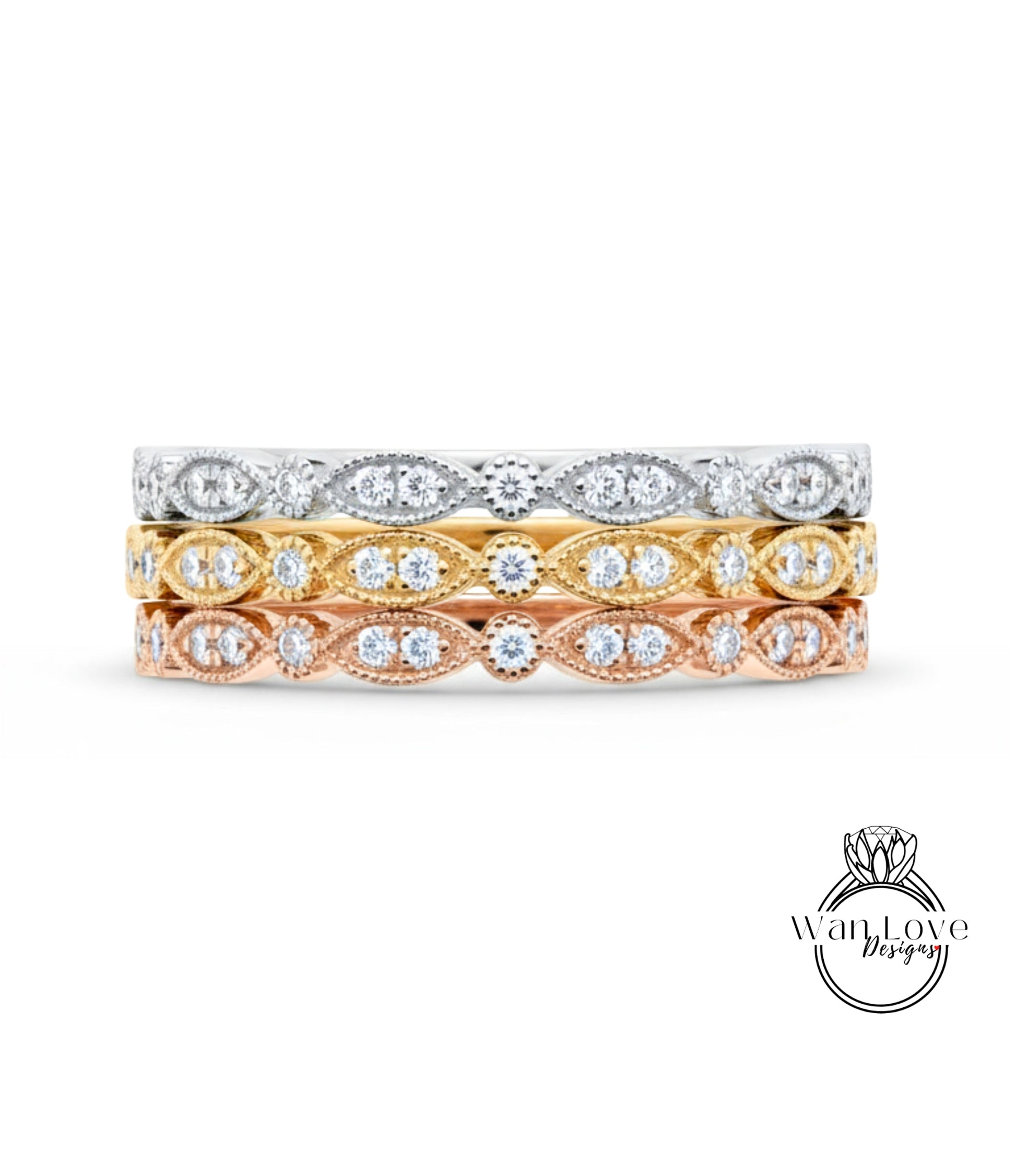 A stack of three rings with different colored gemstones set in the center.