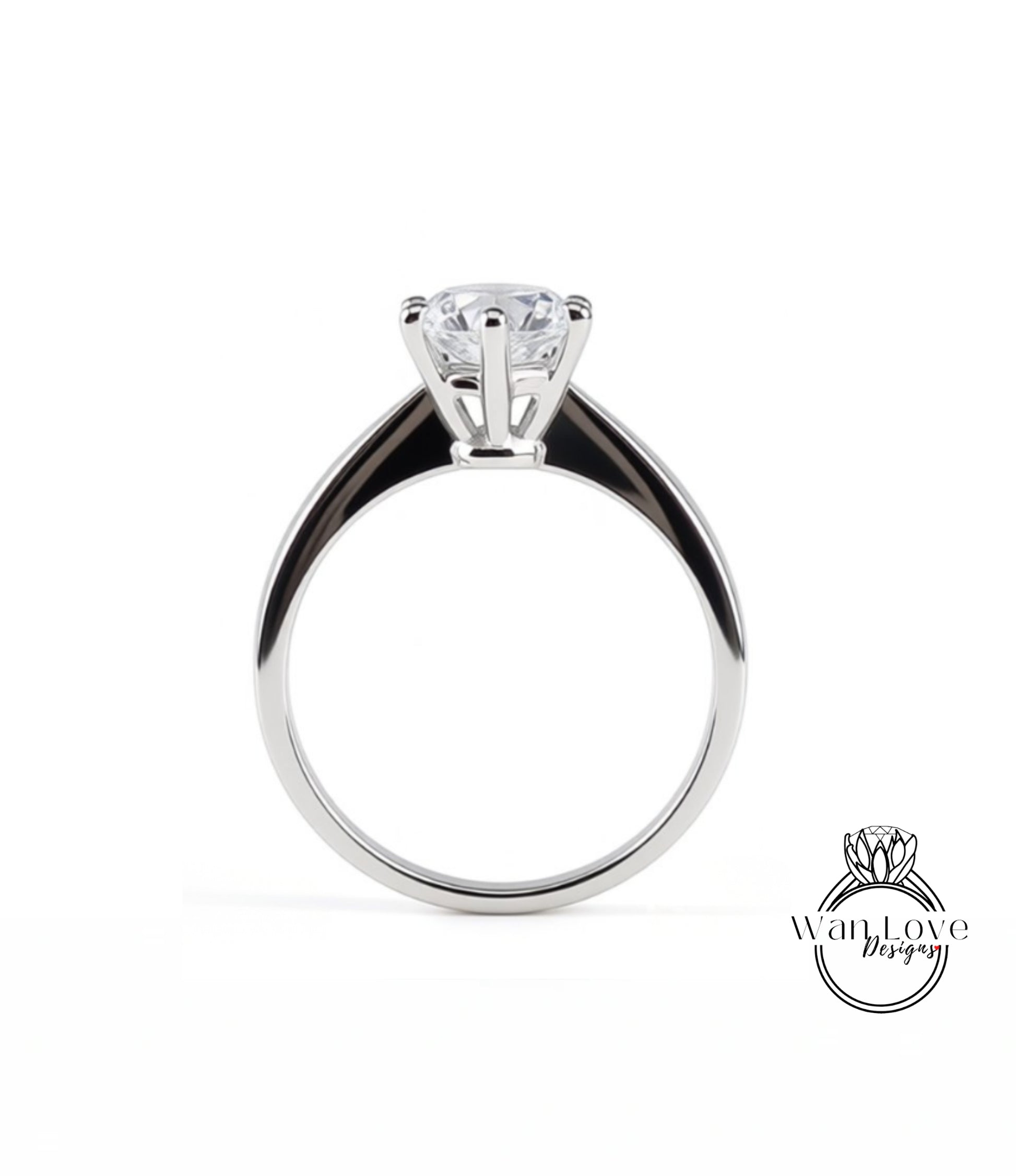 A silver engagement ring with a large central diamond and a smaller diamond on the band.