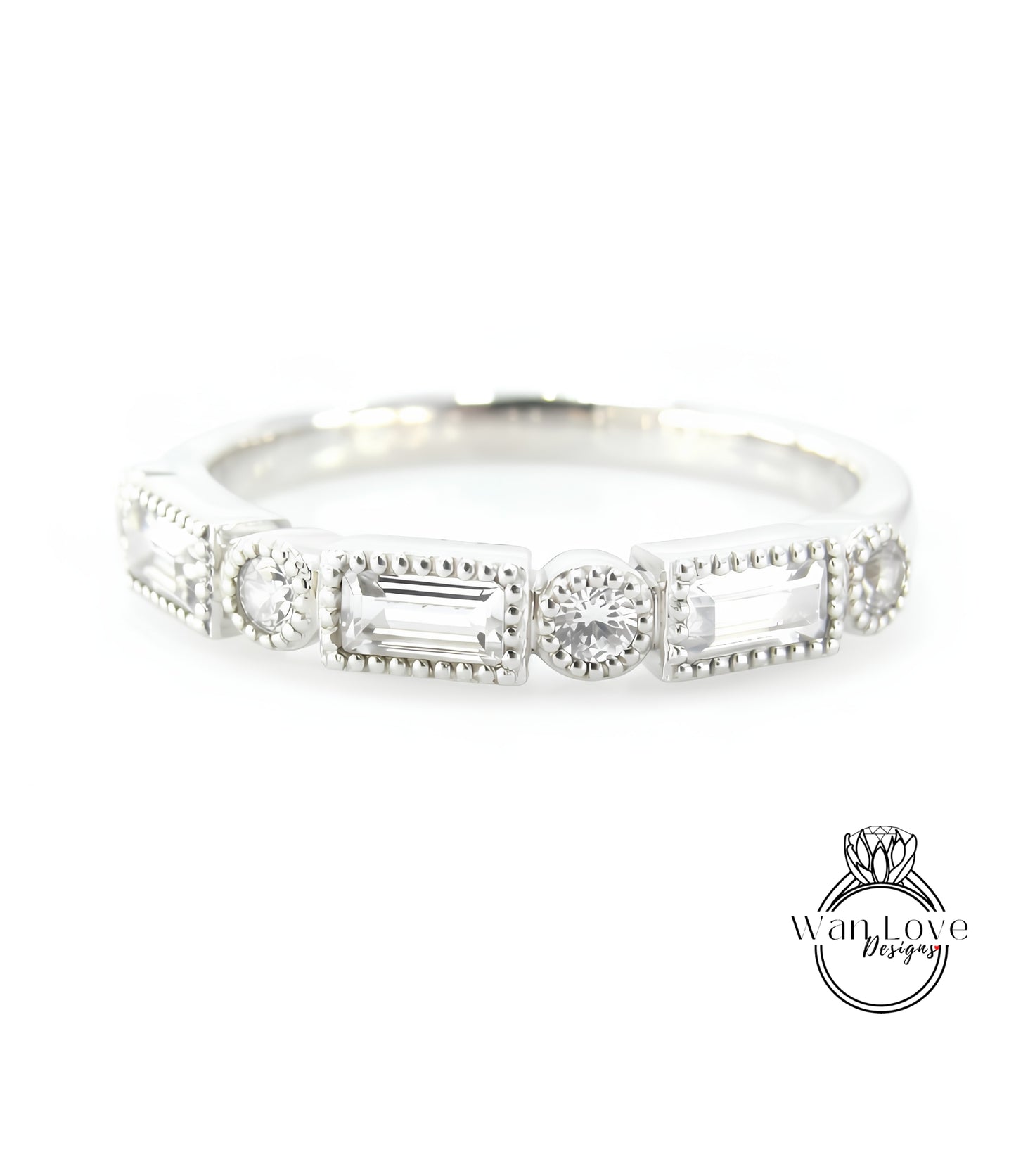 A silver ring with a row of rectangular and square-shaped diamonds set in the center.