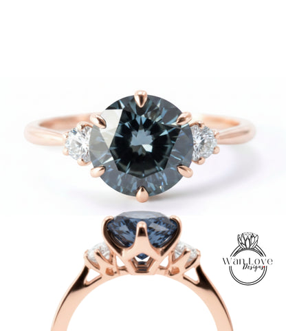 a rose gold ring with a large blue gemstone set in the center, surrounded by smaller diamonds.