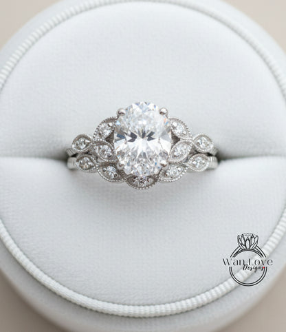 A close-up view of a diamond engagement ring displayed in a white jewelry box.