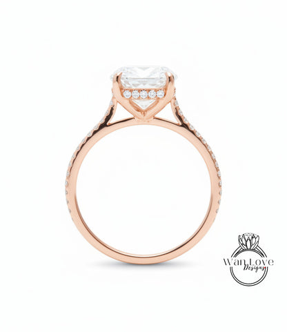 A rose gold engagement ring with a large central diamond and smaller diamonds around the band.