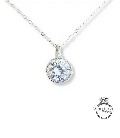 A close-up view of a delicate necklace with a large, round, brilliant-cut diamond pendant.