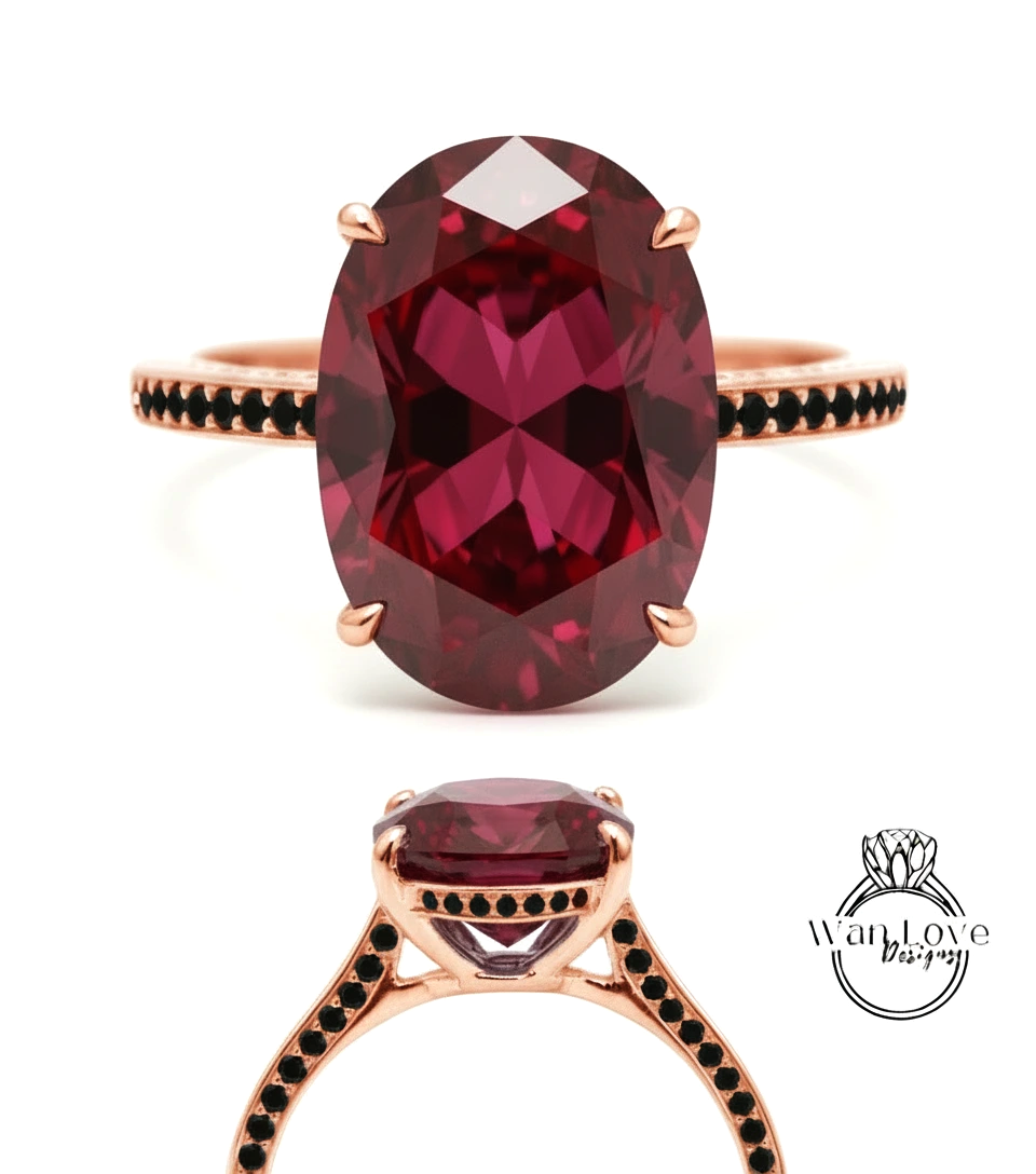 a large, oval-shaped, deep red gemstone ring with a rose gold band and a black diamond accent.