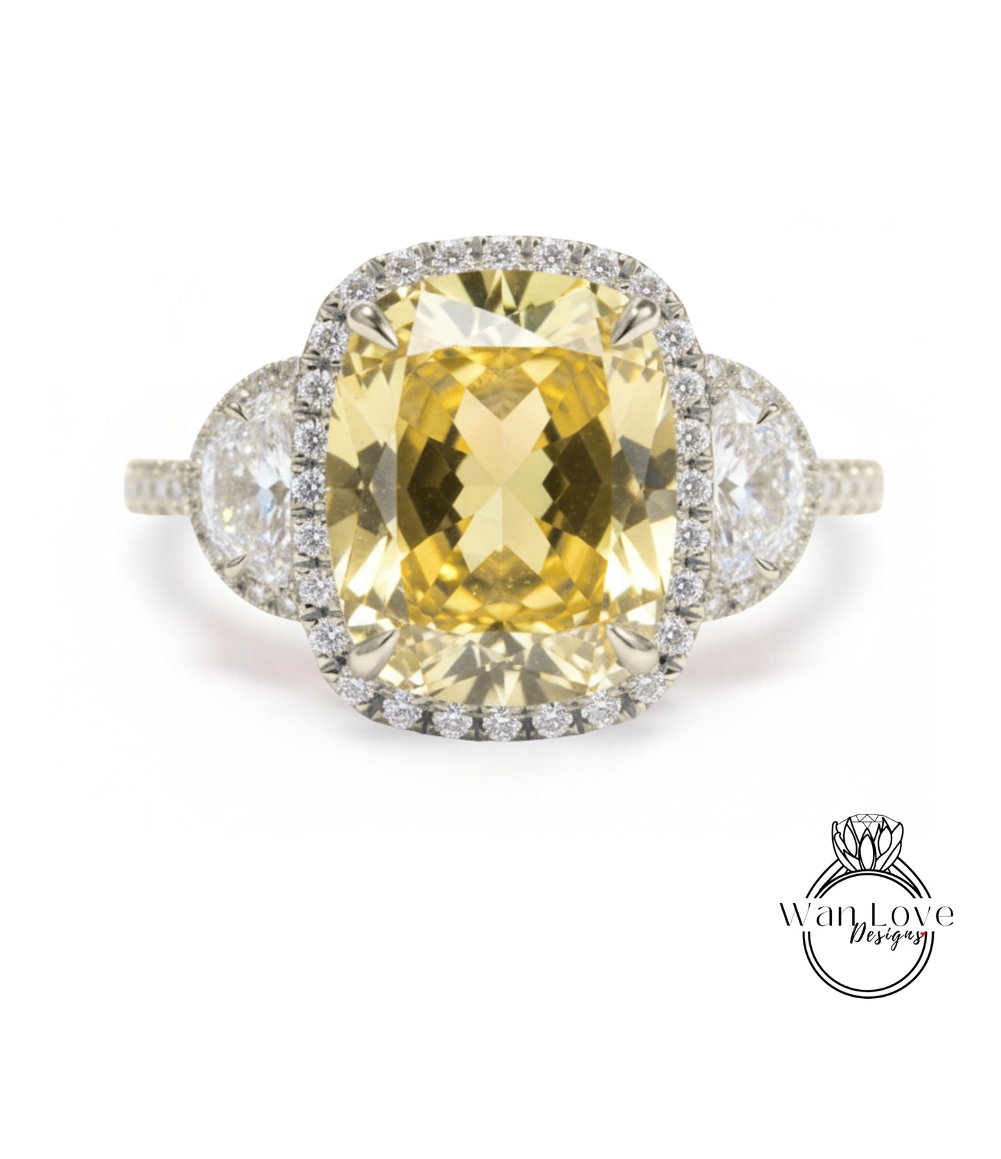 A large yellow gemstone ring with a halo of smaller diamonds around it, set in a silver band.