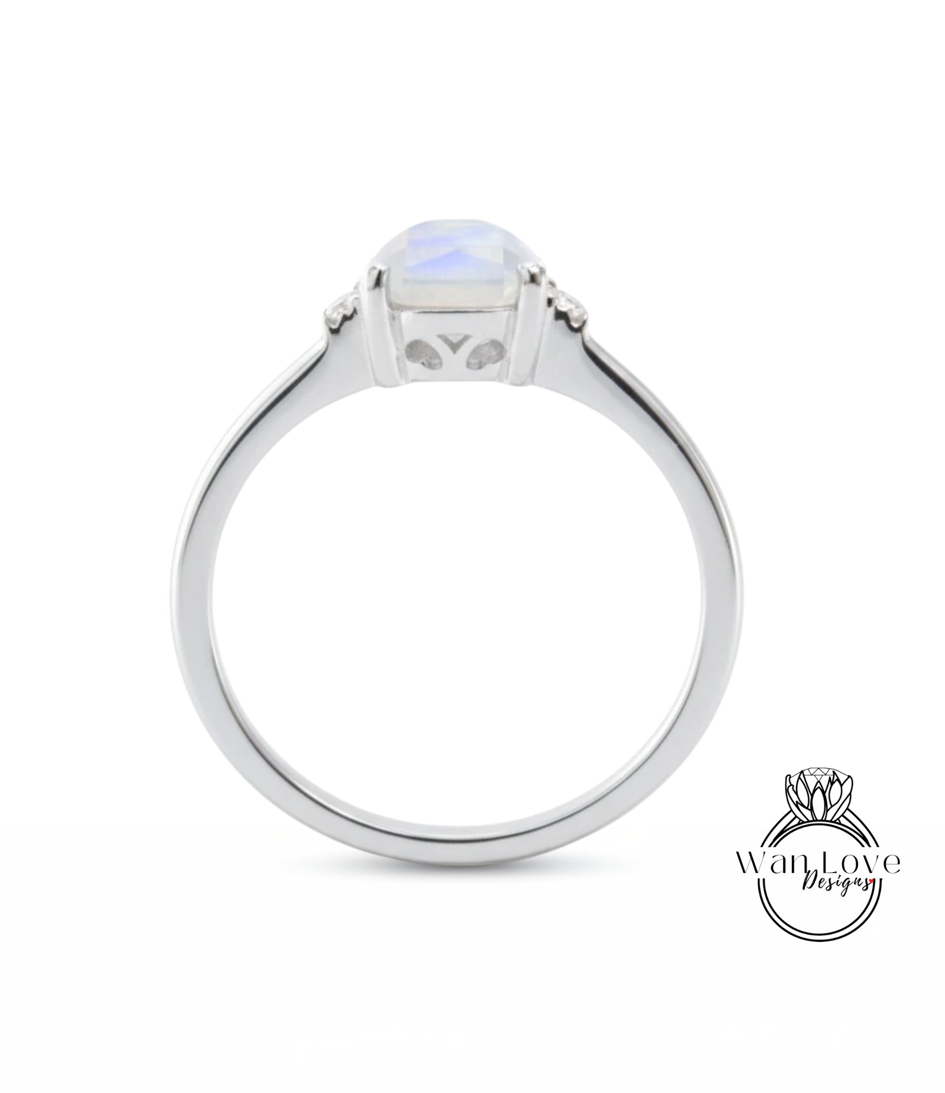 A silver ring with a large, clear gemstone in the center.
