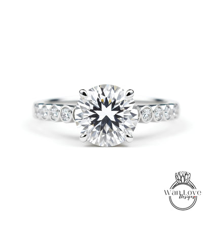 A close-up view of a diamond engagement ring with a large, brilliant-cut diamond set in a silver band.
