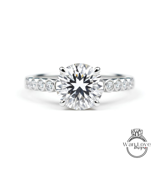 A close-up view of a diamond engagement ring with a large, brilliant-cut diamond set in a silver band.