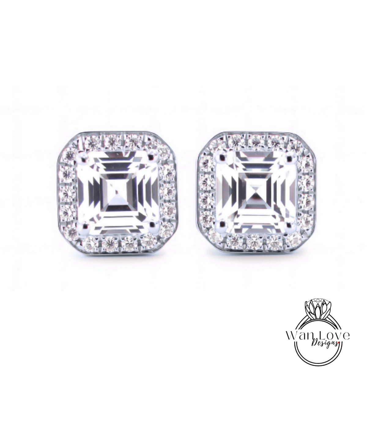 A pair of diamond earrings with large, clear gemstones set in a halo of smaller diamonds.