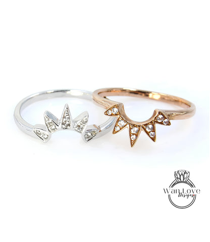 Two rings with gemstone designs are displayed against a white background.